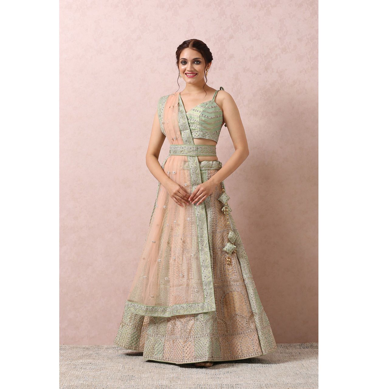 alt message - Mohey Women Pista Embellished Bridal Lehenga image number 0