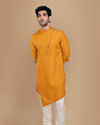 alt message - Manyavar Men Mustard Yellow Asymmetric Kurta image number 1