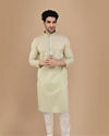 alt message - Manyavar Men Light Green Solid Kurta Set With Neck Detailing image number 0