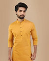 alt message - Manyavar Men Mustard Yellow Solid Kurta image number 0