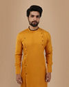 alt message - Manyavar Men Mustard Yellow Self Design Asymmetrical Kurta image number 0