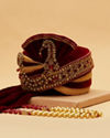 alt message - Manyavar Men Maroon And Gold Brooch Embellished Safa image number 1