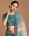 alt message - Mohey Women Sea Green Velvet Lehenga image number 1