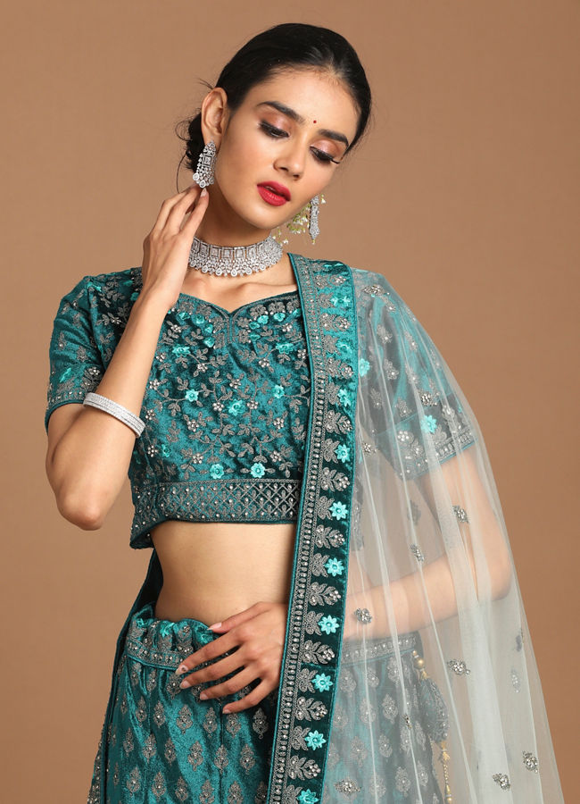 alt message - Mohey Women Sea Green Velvet Lehenga image number 1