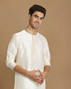 alt message - Manyavar Men Off White Plain Kurta Set image number 0