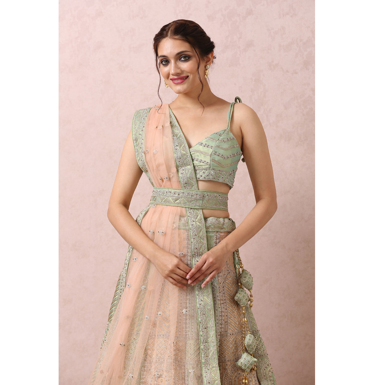 alt message - Mohey Women Pista Embellished Bridal Lehenga image number 1