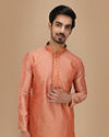 alt message - Manyavar Men Deep Coral Self Motif Kurta Set image number 0