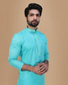 alt message - Manyavar Men Seafoam Green Solid Kurta Set With Neck Detailing image number 0