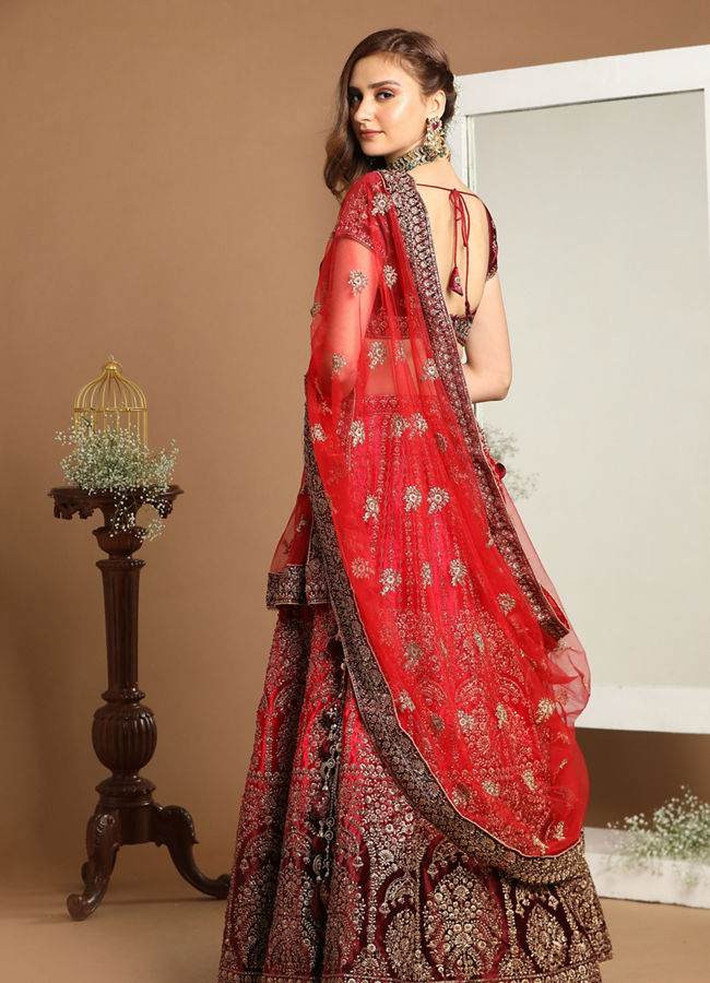 Mohey Women Rani And Maroon Velvet Zari Embroidered Bridal Lehenga