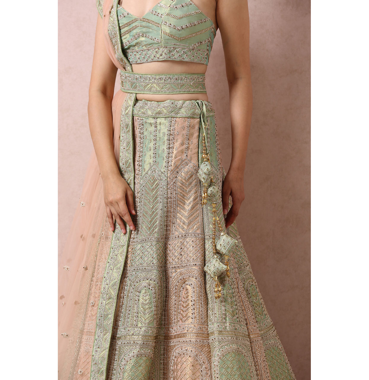 alt message - Mohey Women Pista Embellished Bridal Lehenga image number 4