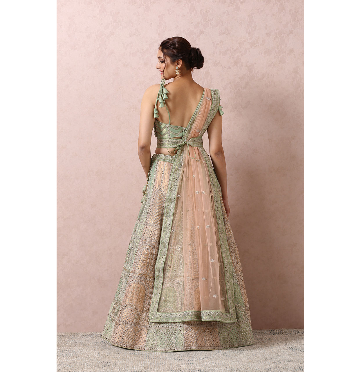 alt message - Mohey Women Pista Embellished Bridal Lehenga image number 3