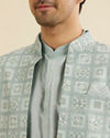 Manyavar Men Soft Green Grid Patterned Indo Western Set with Floral Motifs