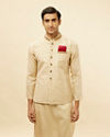 alt message - Manyavar Men Golden Cream Embellished Collar Jacket image number 0