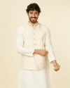 alt message - Manyavar Men Warm Cream Bel Buti Patterned Nehru Jacket image number 0