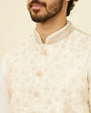 alt message - Manyavar Men Warm Cream Bel Buti Patterned Nehru Jacket image number 1