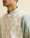 alt message - Manyavar Men Warm White Floral Jaal Patterned Jacket image number 1