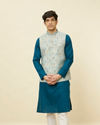 alt message - Manyavar Men Delicate Blue Shankh Patterned Jacket image number 0