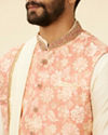 alt message - Manyavar Men Coral Pink Floral Patterned Kurta Jacket Set image number 1