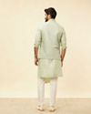 alt message - Manyavar Men Tea Green Bel Buti Patterned Drape Detailed Kurta Jacket Set image number 4