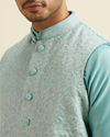 alt message - Manyavar Men Aqua Green Kurta Jacket Set with Exquisite Hand Embroidery and Cutdana Work image number 1