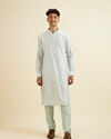 alt message - Manyavar Men Light Blue Kurta Jacket Set with Foil Print and Zari Embroidery image number 4