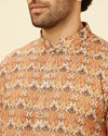 alt message - Manyavar Men Rust Batik Inspired Printed Kurta Set image number 1