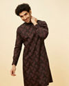 alt message - Manyavar Men Kohl Black Angrakha Style Floral Printed Kurta Set image number 0