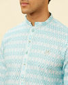 alt message - Manyavar Men Aquamarine Blue Harlequin Printed Kurta Set image number 1