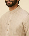 alt message - Manyavar Men Solid Walnut Self Striped Patterned Kurta image number 1