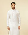 alt message - Manyavar Men Classic White Self Striped Patterned Kurta image number 0