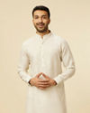 alt message - Manyavar Men Warm White Self Patterned Kurta image number 0