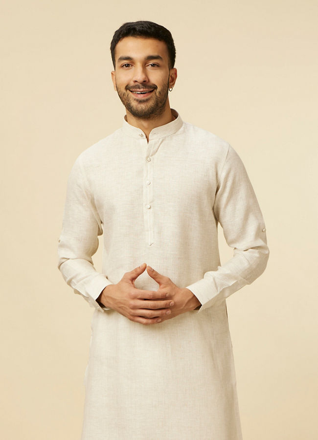 alt message - Manyavar Men Warm White Self Patterned Kurta image number 0