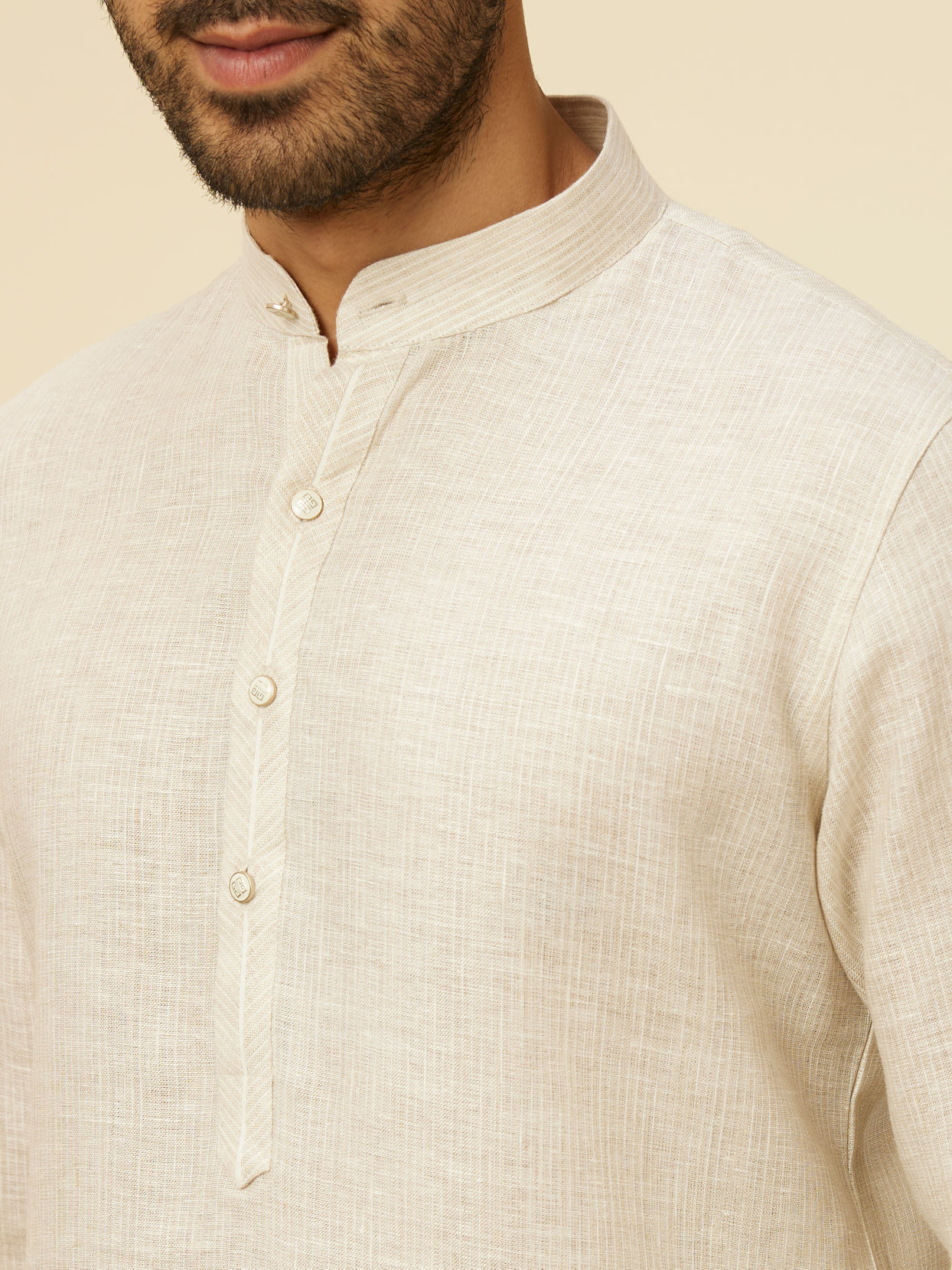 alt message - Manyavar Men Warm White Self Patterned Kurta image number 1