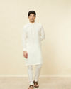 alt message - Manyavar Men Warm White Square Grid Printed Kurta image number 1