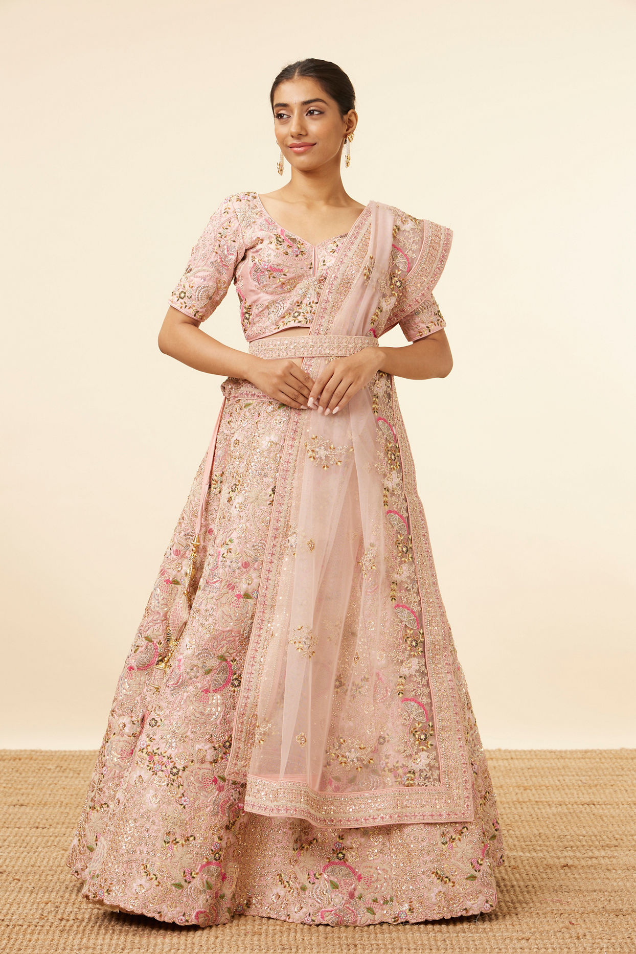 alt message - Mohey Women Light Pink Sequined Floral Bridal Lehenga image number 0