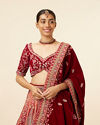 alt message - Mohey Women Mustard Red Embroidered Bridal Lehenga image number 1