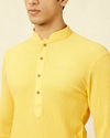 alt message - Manyavar Men Summer Daffodil Yellow Half Placket Kurta image number 1