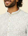 alt message - Manyavar Men Light Mid Green Geometric Patterned Angrakha Style Kurta image number 1