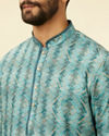 alt message - Manyavar Men Turquoise Geometric Floral Printed Kurta image number 1