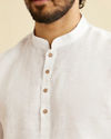 alt message - Manyavar Men Warm White Classic Short Kurta image number 1