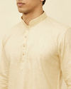 alt message - Manyavar Men Sand Beige Square Grid Patterned Short Kurta image number 1