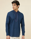 alt message - Manyavar Men Sapphire Blue Embroidered Neckline Short Kurta image number 0