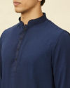 alt message - Manyavar Men Navy Blue Embroidered Neckline Short Kurta image number 1