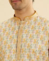 Manyavar Men Soft Beige Paisley Printed Short Kurta with Striped Neckline