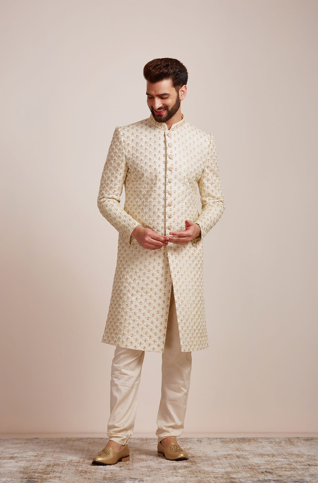 alt message - Manyavar Men Golden Cream Patterned Sherwani Set image number 1