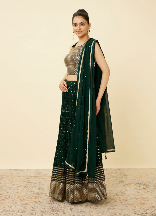 alt message - Mohey Women Forest Green Sequined Lehenga image number 3