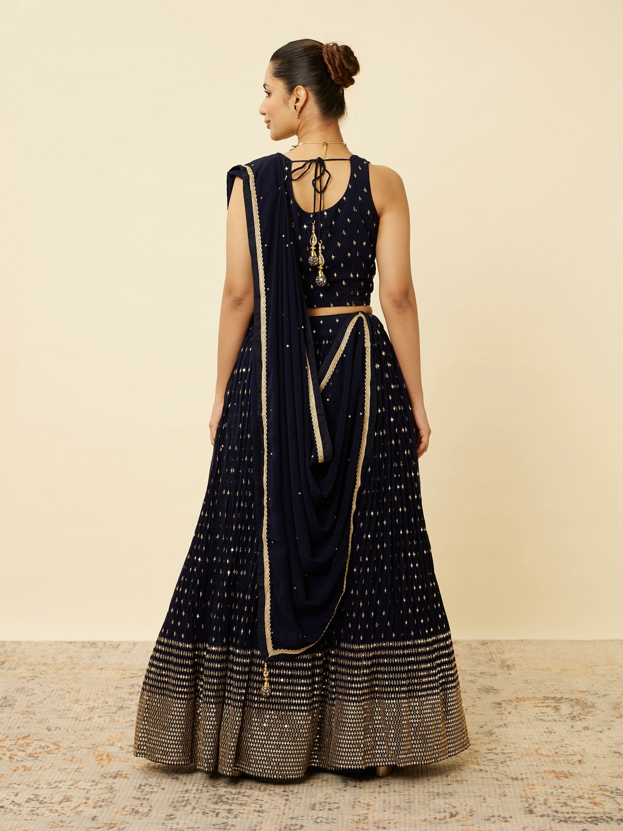 alt message - Mohey Women Indigo Blue Sequined Lehenga image number 4