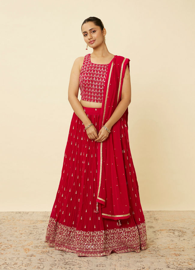 alt message - Mohey Women Coral Red Embroidered Lehenga image number 0