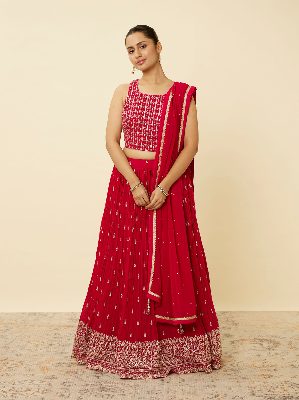 alt message - Mohey Women Coral Red Embroidered Lehenga image number 0