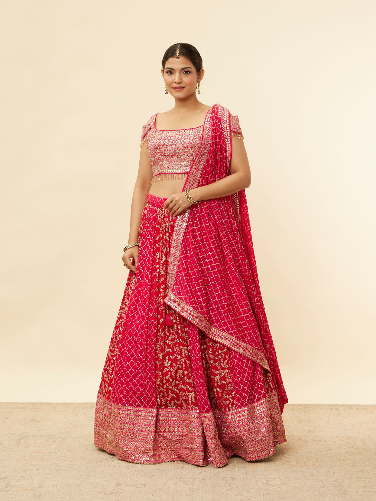 alt message - Mohey Women Berry Pink Sequined Jaal Patterned Lehenga image number 0